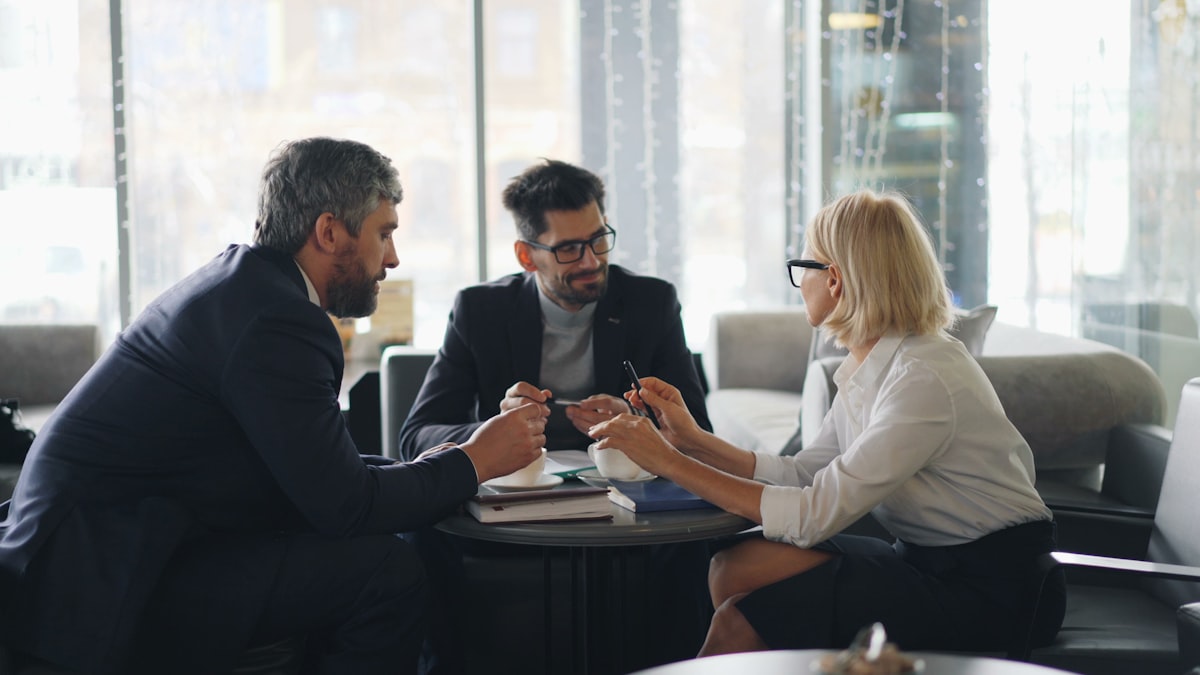 Accountant walking clients through their numbers at a meeting table